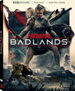 Cover art for the movie 'Predator: Badlands' featuring an intense scene with a predator creature and various characters in an action-packed environment.