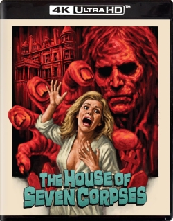 The DVD cover of 'The House of Seven Corpses' featuring a terrified woman in a white dress, with a haunted house and a ghostly figure in the background, in a horror-themed design.